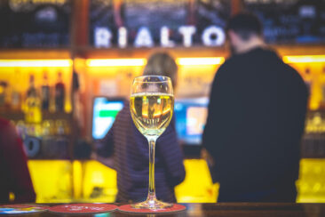 Food and restaurant photography, branding and product photography, lifestyle corporate photography, photo of a glass of white wine on the bar, Rialto Amsterdam