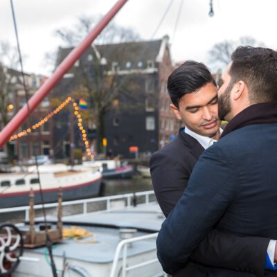 Couple photography, proposal photography, 2 gay men are tenderly hugging each other after they just got engaged, Brouwersgracht, Amsterdam