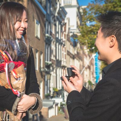 Proposal photography, a man is proposing to his girlfriend on a bridge by Reguliersgracht, Amsterdam