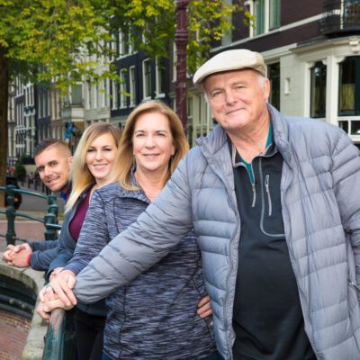 Lifestyle family photography, happy family together posing by a bridge near Brouwersgracht, Amsterdam