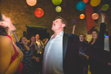 party photography, birthday party photography, wedding photography, bride and groom are having a great time dancing and singing among their guests, Utrecht