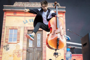 Concert photography, festival photographer, cellist jumping at concert of French Rap band BigFlo & Oli at Paleo Festival, Nyon, Switzerland - 21 July 2018