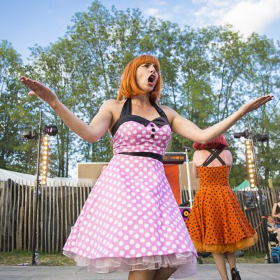 Festival photography, theatre show with ladies with 50's dress at Paléo Festival, Nyon, Switzerland
