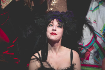 Event photography, festival photography, theatre photography, portrait of a comedian looking performing at a burlesque show at Tobacco Theater, Amsterdam