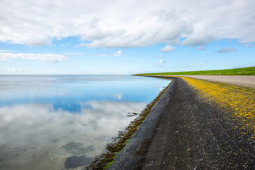 Landscape photography, view of the coastline with a dam on Ameland Wadden island