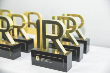 Corporate event photography, conference photography, photo of the awards on the table before the IR award ceremony, Amsterdam