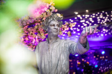 Corporate event photography, party photography, an artist dressed as a statue is performing during a DHL party at Hilton Hotel, Amsterdam, Netherlands