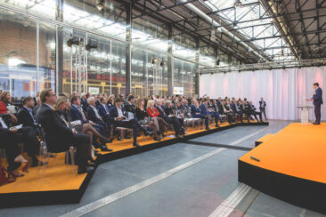 Corporate event photography, conference photography, the audience is listening to the speaker on stage, Transformation Forum, Den Haag