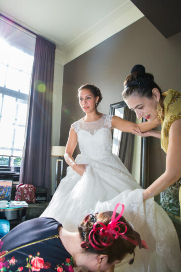 Bruidsfotograaf, trouwfotograaf, Wedding photography, bride photography, elopement photographer, marriage photography, a bride is getting ready with the help of her bridesmaids, College Hotel, Amsterdam