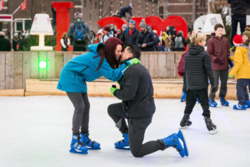 Proposal photography, couple photoshoot, loveshoot, engagement photoshoot: a man is proposing to his girlfriend on Museumplein ice skating rink in Amsterdam