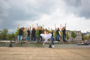 Bachelorette party photoshoot, EVJF, portrait of a group of friends jumping in the air, celebrating the wife-to-be, Amsterdam