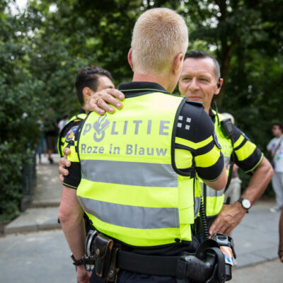 Journalistic photography, event photography, policemen at Pink Saturday during Gay Pride, Amsterdam