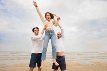 Family photoshoot, sibling sister and brothers jumping on the beach in Zandvoort, The Netherlands