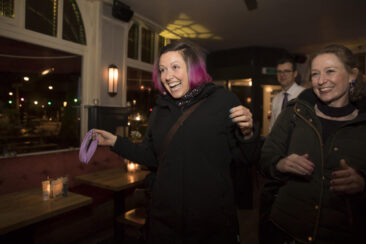 private photography, birthday photography, portrait of a happy lady coming in at her surprise birthday party, Amsterdam
