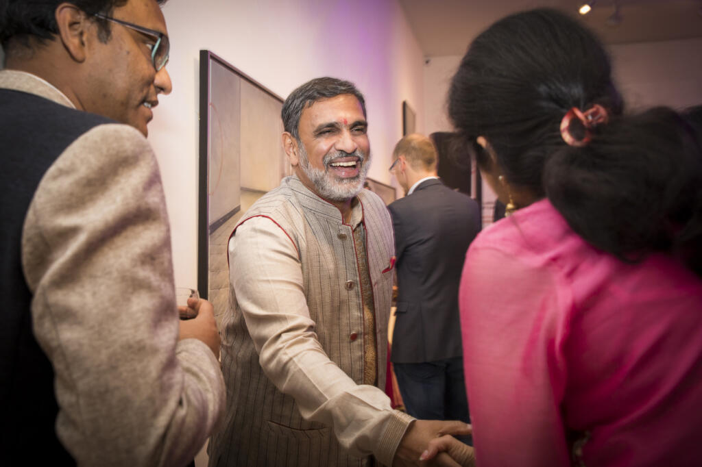 Corporate event photography, conference photography, the Indian ambassador in the Netherlands is shaking hand with a participant, Amstelveen