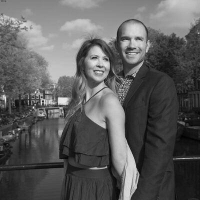 Couple photography, black and white portrait of a man and woman posing by a romantic canal, Brouwersgracht in Amsterdam