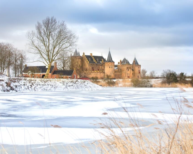 Landscape photography, branding and marketing photography, photo of the Muiderslot Castle and surroundings under the snow in the winter for website and brochure, Muiden, The Netherlands