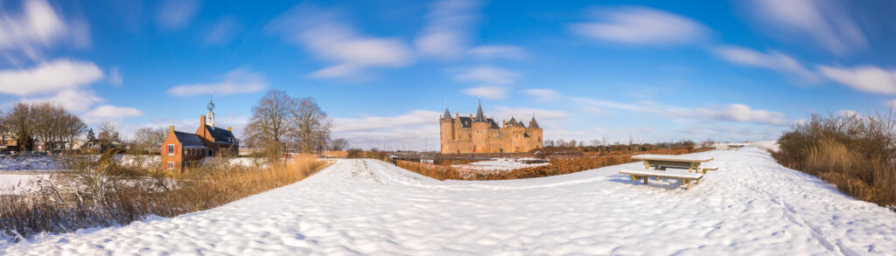 Landscape photography, branding and marketing photography, panorama photo of the Muiderslot Castle and surroundings under the snow in the winter for website and brochure, Muiden, The Netherlands