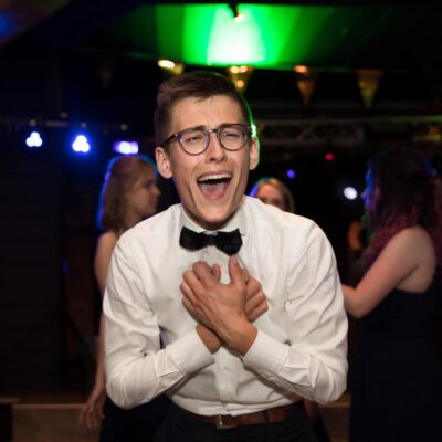 Birthday Party photography, young man dancing and singing at a gala party, the Netherlands