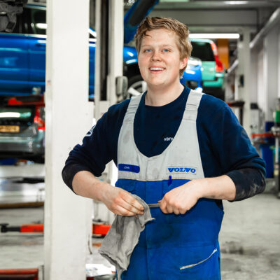Lifestyle corporate photography, portrait of professional technician in his Volvo garage, Amsterdam Noord