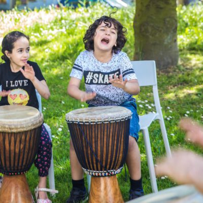 Festival photography, kids are playing Djembe during a workshop at Vrijheidsmaaltijd, WOW, Amsterdam