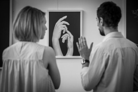 Cultural event photography, 2 people are looking at an artwork during Kunst Rai exhibition for WOW in Amsterdam