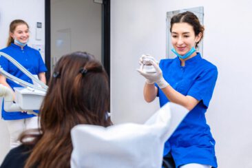 Interior photography, branding photography, corporate lifestyle photography, lifestyle photo of a young woman dentist showing the treatment process to a patient, Amsterdam