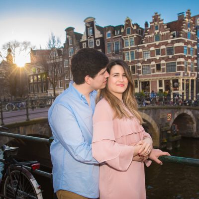Couple and engagement photoshoot, a man and woman are posing by sunset by the Brouwersgracht, Amsterdam