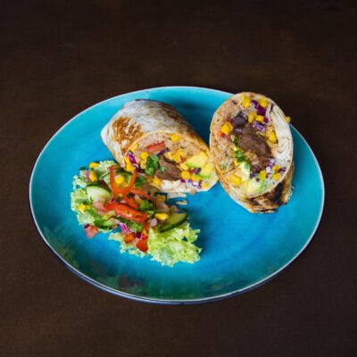 Food photography, zoom on a Mexican burrito in a restaurant in Amsterdam