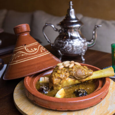 Food photography, zoom on a Moroccan tagine lamb dish in a restaurant in Amsterdam