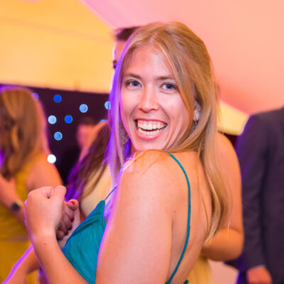 Wedding photography, party photography, a young lady is smiling and dancing at a wedding party, Feel Good Tent Event, Lage Vuursche