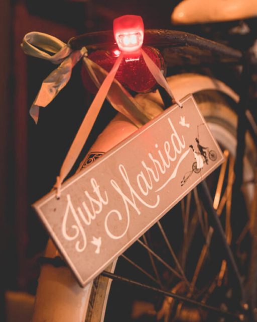 Wedding photography photo of a bridal bike with a "just Married" sign during a wedding in Amsterdam