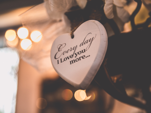 Wedding photography photo of a wooden heart with written on it "Everyday I love you more" at a wedding in Amsterdam