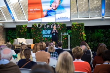 Corporate event photography, conference photography, a speaker is giving a presentation during the Dentius conference in Amsterdam