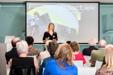 Corporate event photography, conference photography, a speaker is giving a presentation during workshop and breakout sessions during the Film Netwerk Educatie conference in Eye Film institute in Amsterdam