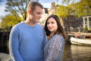 Couple photoshoot, loveshoot, engagement photoshoot: portrait of a couple is posing near romantic canal Brouwersgracht at sunset, Amsterdam