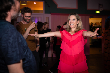 Corporate party photography, wedding photography, birthday photography, a lady is dancing and having a good time at a party, Amsterdam
