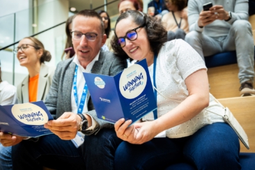 Corporate event photography, conference photography, participants networking and shaking hands during a conference at Danone Office in Amsterdam
