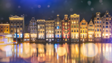 Landscape photography, view of typical Amsterdam city skyline at night, photo taken for illustration on website, brochure and social media