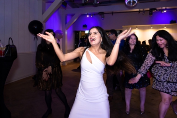 Corporate party photography, wedding photography, birthday photography, a young lady is dancing and having a good time at a party, Amsterdam